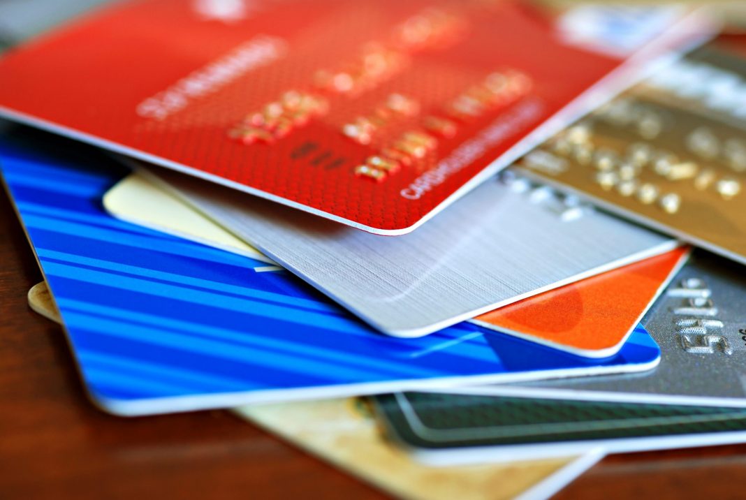 Colorful stack of credit cards and shopping gift cards. Macro w